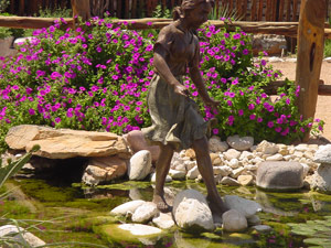 Laura Bush in statue background