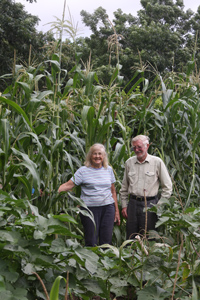 Malcolm with wife, Delphine, by TALL corn he developed