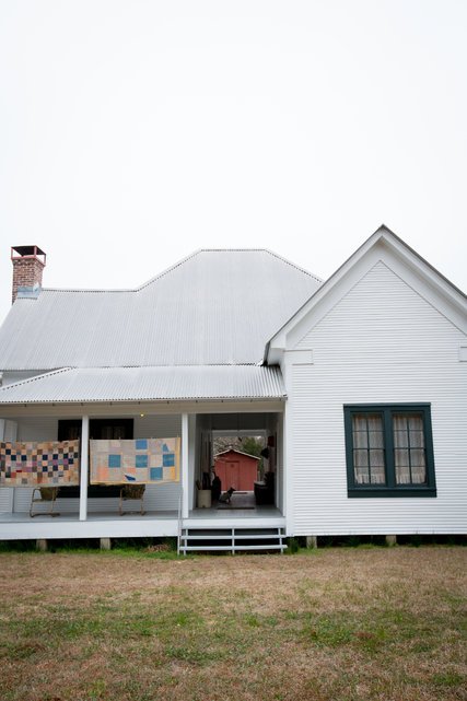 Family quilts hang on the porch of Big Momma’s house, the dwelling of Mr. Grant’s great-grandparents, where his father played as a child.