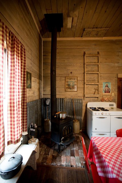 A detail of the re-rusticated kitchen in one of his many houses.